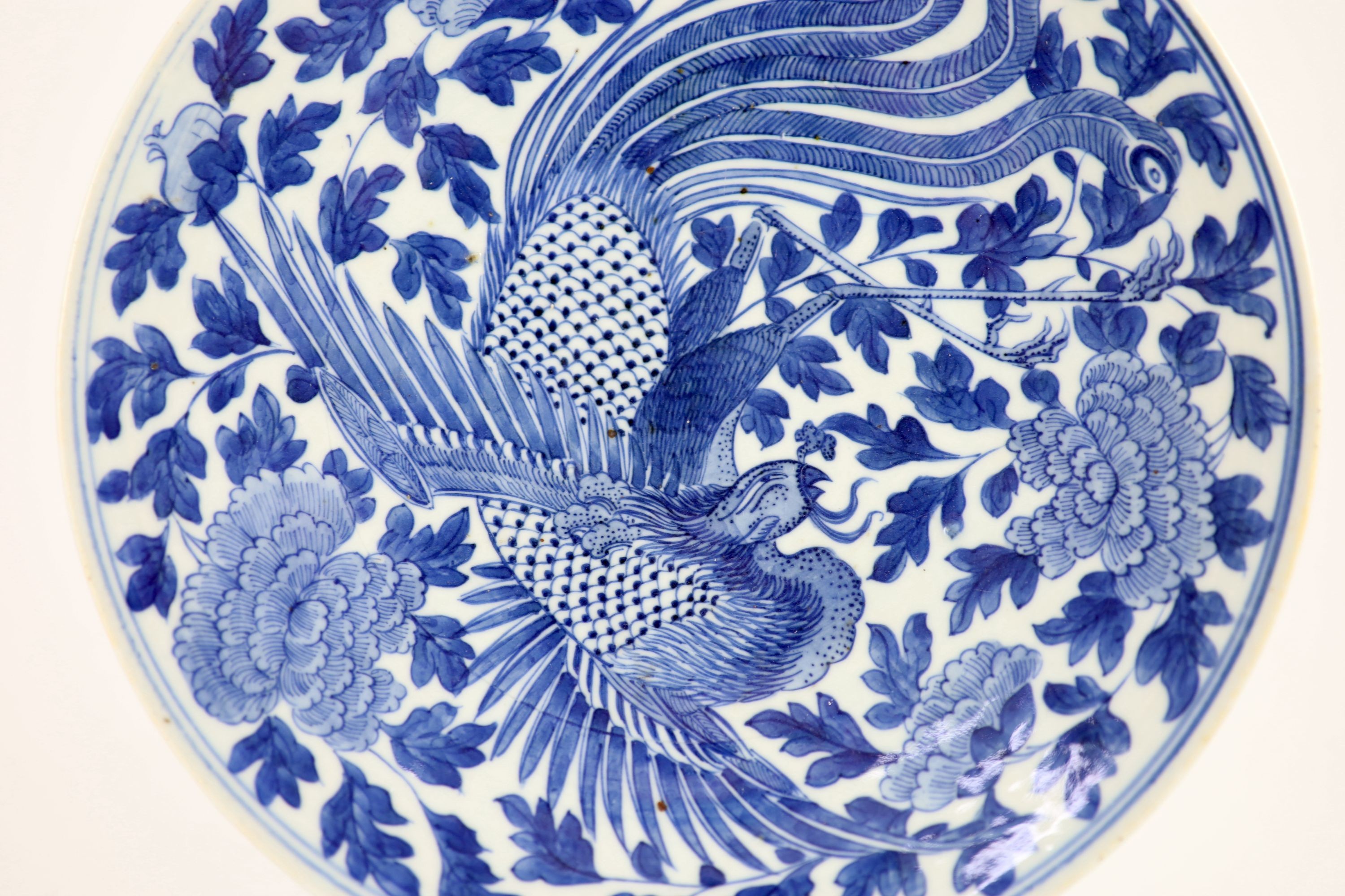 A Chinese blue and white ‘phoenix’ dish, Daoguang mark and period (1821-50), 29.7 cm diameter
